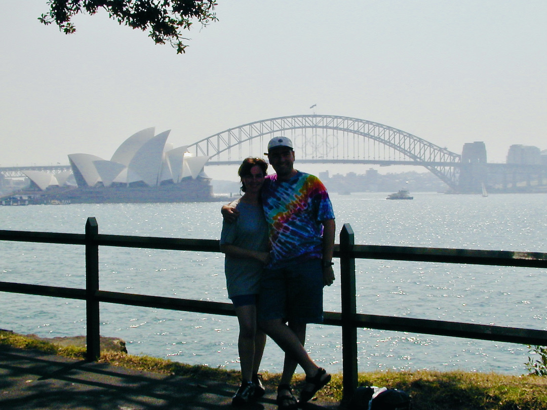 Sharon and David Schindler with the Sydney Opera House and Sydney Bridge behind them.