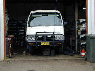 Spot the camper van in the garage for repairs.
