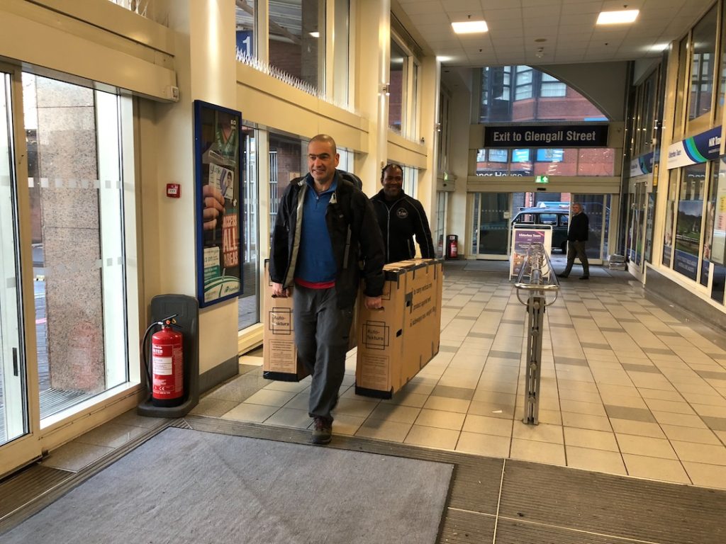 Carrying the bike boxes through the bus station