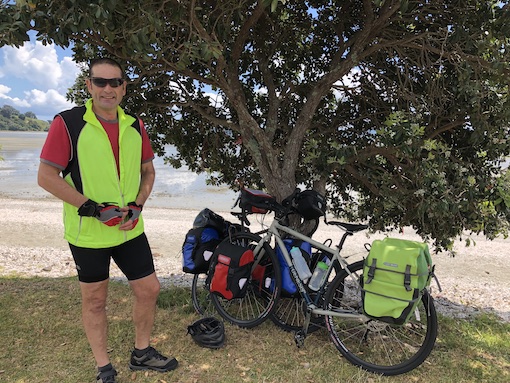 Dave with his touring bike at Kawakawa Bay New Zealand