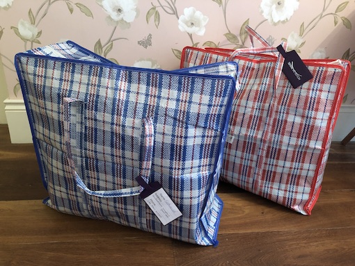 Blue and red and white checked shopping bags