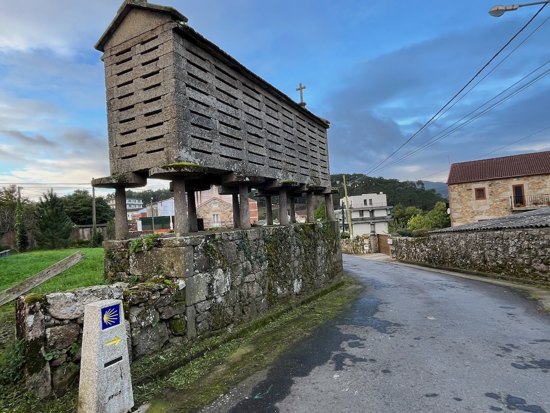 Photo of a traditional Galician Granary built of stone and wood and raised above the ground on stone pillars