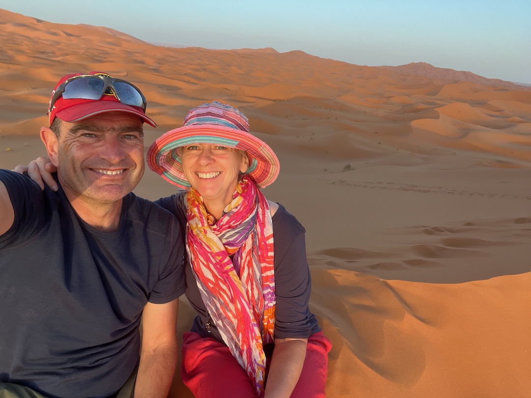 Schindlers in the Sahara Desert Morocco David and Sharon Schindler in the Sahara Desert in Morocco with sand dunes behind them